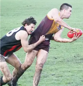  ??  ?? Opposing ruckmen Damien Allison of Drouin (right) and Maffra’s Kieran Jones battled it out at ground level as well as in the air during Saturday’s clash at Drouin.