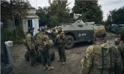  ?? September. Photograph: Kostiantyn Liberov/AP ?? The Ukrainian army is becoming ‘an agile and modern network of truly collaborat­ive units’. Ukrainian soldiers in Izium, Kharkiv region, Ukraine 13