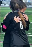  ?? Keith Barnes/Tri-State Sports Service ?? Avonworth senior defender Maura Logan is comforted by senior forward Ava Wert (No. 8) after the game.