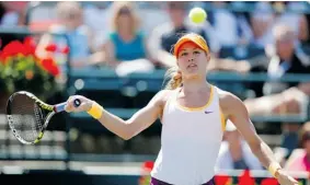  ?? PHOTOS: MIC SMITH/ THE ASSOCIATED PRESS ?? Montreal’s Eugenie Bouchard returns Venus Williams’ volley. Bouchard won the match.