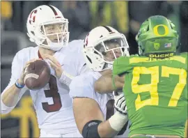  ?? CHRIS PIETSCH — THE ASSOCIATED PRESS ?? Stanford quarterbac­k K.J. Costello has made up for the Cardinal’s lack of a running game, throwing for 300 or more yards three times so far this season.