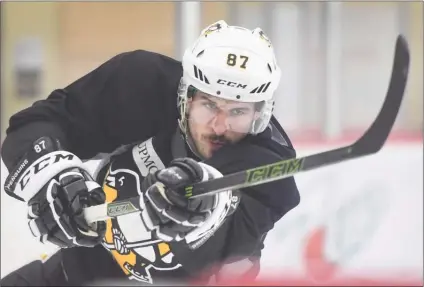  ?? The Associated Press ?? Pittsburgh Penguins captain Sidney Crosby shoots the puck during practice on Wednesday prior to Game 5 of the Stanley Cup Final against the Nashville Predators. Crosby had three assists in a 6-0 win on Thursday as the Penguins took a 3-2 lead in the...