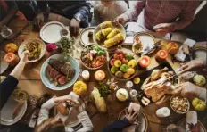  ?? Shuttersto­ck ?? A holiday focused on food can be a struggle for people who struggle with weight and body issues.