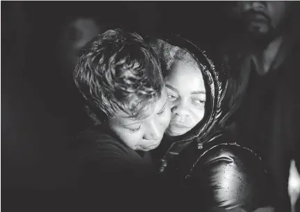  ??  DAVID GOLDMAN/THE ASSOCIATED PRESS FILES ?? Lesley McSpadden, left, Michael Brown’s mother, embraces his cousin, Sabrina Webb, in Ferguson, Mo., last November. Webb says DeAndre Joshua knocked on her door hours before he was killed last November, but police have yet to talk to her.