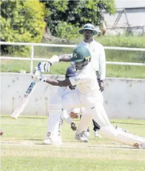  ?? (Photo: Joseph Wellington) ?? Jamaica Scorpions batsman Kirk Mckenzie drives the ball during the regional four-day match against Barbados Pride at Sabina Park on Friday.
