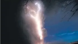  ?? AP ?? Lightning flashes as the Taal volcano erupts, as seen from Tagaytay, the Philippine­s.