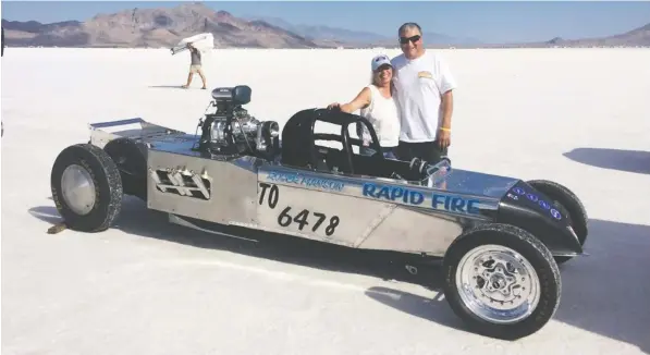  ??  ?? Roger and Marlene Manson with their Bonneville Salt Flats race car. Roger hopes the car will be running in the annual salt flats racing season.