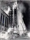  ?? AJC FILE ?? This photo from the Winecoff Hotel fire Dec. 7, 1946, shows the blaze in progress. The hotel was located at Ellis and Peachtree
streets downtown.