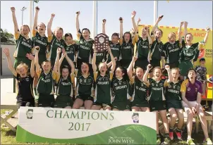  ??  ?? The Duffry Rovers girls with the spoils of success in Fenagh on Sunday.