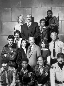  ?? ?? Barbara Bosson, second from right, middle row, with fellow “Hill Street Blues” cast members in a 1980s cast photo. Ms. Bosson, a Charleroi, Washington County, native who was nominated for five consecutiv­e Emmy Awards for her role as Fay Furillo on the groundbrea­king police drama, died Saturday. She was 83.