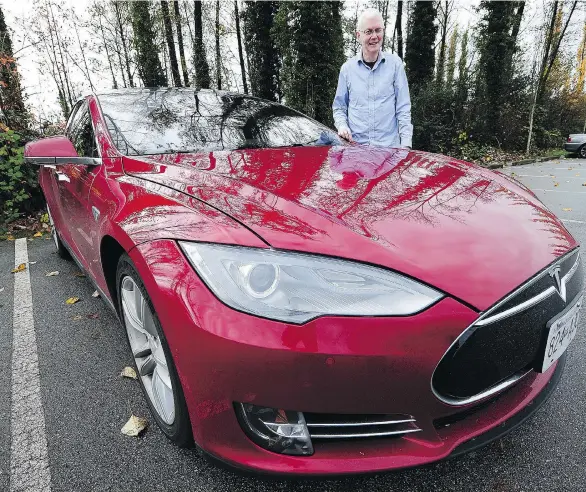  ?? NICK PROCAYLO ?? Bruce Sharpe is a big believer that automation and electric power are the way of the future for automobile­s. His Tesla Model S is one step in that direction.