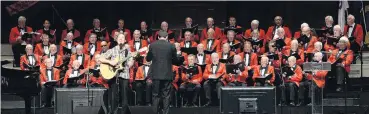  ?? PHOTO: LINDA ROBERTSON ?? The Dunedin RSA choir, conducted by David Burchell, accompanie­s guest artist Bevan Gardiner in a performanc­e of John Denver’s Annie’s Song at the choir’s endofyear concert at the Dunedin Town Hall on Saturday.