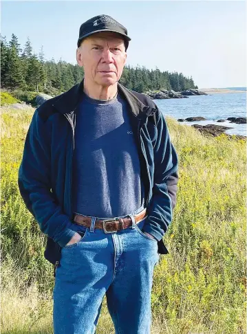  ?? Donna Hopkins/Associated Press ?? Charlie Hopkins stands near his home along the shoreline of Isle au Haut Maine. The island, which is accessible only by boat, has slow internet service in some locations, including at Hopkins’ home. Hopkins has concerns about a U.S. Treasury Department rule that narrows the eligibilit­y for broadband infrastruc­ture spending under the American Rescue Plan, which provides $350 billion of flexible funds to state and local government­s.