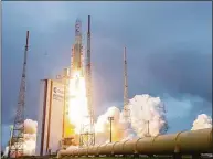  ?? JM GUILLON / Associated Press file photo ?? Arianespac­e's Ariane 5 rocket with NASA's James Webb Space Telescope onboard, lifts off Dec. 25, 2021, at Europe's Spaceport, the Guiana Space Center in Kourou, French Guiana.