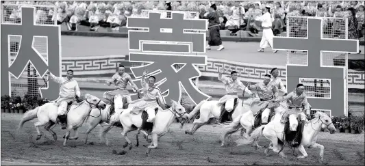  ?? Photo: CFP ?? Horsemen compete in a ceremonial event on Tuesday in Hohhot, Inner Mongolia Autonomous Region to celebrate the 70th anniversar­y of the region’s founding.