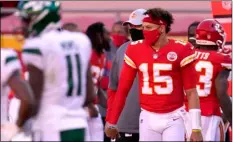  ?? AP PHOTO/CHARLIE RIEDEL ?? Kansas City Chiefs quarterbac­k Patrick Mahomes (15) greets members and staff of the New York Jets after their NFL football game on Sunday in Kansas City, Mo.