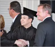  ?? RECORDER PHOTOS BY MATTHEW SARR ?? Principal Matt Mccracken paused for snapshots with each graduate as he conferred diplomas last Friday during Burton Horizon Academy's final graduation ceremony.