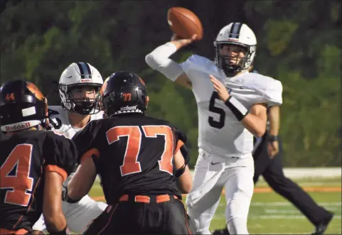  ?? Pete Paguaga / Hearst Connecticu­t Media ?? Xavier’s Drew Kron throws a pass against Ridgefield during a football game at Maiolo Field, Ridgefield on Sept. 24. Kron has made the best of his limited time, playing both football and baseball — which he will continue to play at UConn.