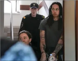  ?? ALEXANDER ZEMLIANICH­ENKO – THE ASSOCIATED PRESS ?? SPORTSWIRE
WNBA star and two-time Olympic gold medalist Brittney Griner is escorted to a courtroom for a hearing in Khimki just outside Moscow on June 27.