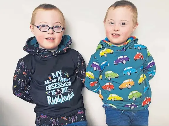  ?? Picture: SWNS. ?? The video shows identical twins Ollie and Cameron Scougal test out jobs to raise awareness of Down’s syndrome.