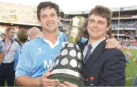  ?? Pictures: Gallo Images ?? DREAM TEAM. Blue Bulls captain Anton Leonard and coach Heyneke Meyer after winning the title in 2003.