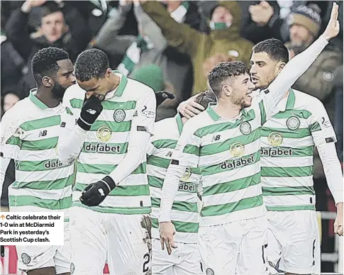  ??  ?? 0 Celtic celebrate their 1-0 win at Mcdiarmid Park in yesterday’s Scottish Cup clash.