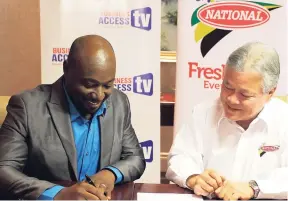  ??  ?? Garth Walker (left), managing director, BATV, and Gary ‘Butch’ Hendrickso­n, chairman of National Bakery, sign the deal at the National Bakery head office in St Andrew to bring the Bold Ones to television.