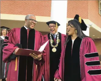  ?? BO EMERSON/AJC ?? Billionair­e Robert F. Smith (from left), Morehouse College President David Thomas and actress Angela Bassett are all smiles at Morehouse College graduation ceremonies Sunday.