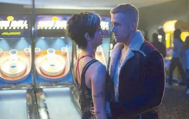  ??  ?? Balls up: Reynolds and Morena Baccarin are a pair of misfits who share a love of skeeball in Deadpool.