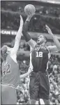  ?? KAMIL KRZACZYNSK­I — AP ?? Spurs forward LaMarcus Aldridge shoots over Bulls defender Robin Lopez during Saturday night’s victory.