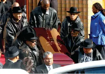  ?? Er his funeral 05 — AFP file photo ?? The coffin of Run DMC’s Jam Master Jay, nee Kevin Mizell, is carried out of Allen A.M.E Cathedral a November, 2002. Mizell was shot to detach 30 October, 2002 in a New York Recording studio.