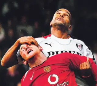  ?? EDDIE KEOGH/REUTERS ?? Fulham’s Alain Goma employs his pinkie in an unsolicite­d eye examinatio­n on Man U’s Wayne Rooney.