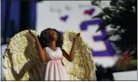  ?? AARON DOSTER — THE ASSOCIATED PRESS ?? A figurine of an angel stands at the display set up for the Bills’ Damar Hamlin outside of University of Cincinnati Medical Center on Wednesday in Cincinnati.