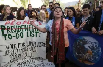  ?? FADEL SENNA/AFP/GETTY IMAGES ?? Activists at the UN climate talks in Morocco insist Donald Trump cannot derail the global shift to clean energy.