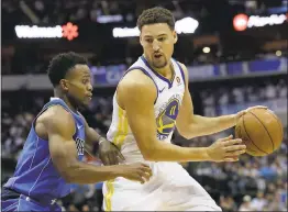  ?? LM OTERO — ASSOCIATED PRESS ?? Warriors guard Klay Thompson dribbles against Dallas’ Yogi Ferrell on Monday night in Dallas. Thompson scored 21points, making nine of 16attempts from the field.