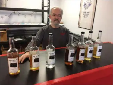  ?? CHAD FELTON — THE NEWS-HERALD ?? Ken “Doc” Howard is celebratin­g the two-year anniversar­y of his family’s Perry-based micro-distillery this weekend with an official unveiling of two new spirits, Tribute40 and Kilted Whiskey, not shown. The business now offers nine products.