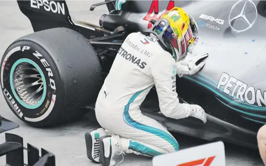  ?? Pictures: AFP ?? GOOD CAR, GOOD CAR. Lewis Hamilton gives his Mercedes the credit it deserves after winning last Sunday’s Brazilian Grand Prix.