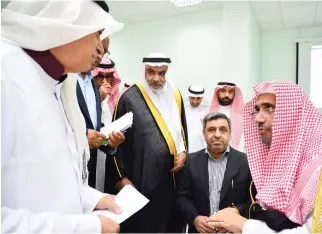  ??  ?? Muhammad bin Abdulkarim Al-Issa, secretary-general of the Muslim World League (MWL) and chairman of IIROSA, right, Hassan Darweesh Shahbar, secretary-general of IIROSA and other guests celebrate World Orphans Day in Jeddah.