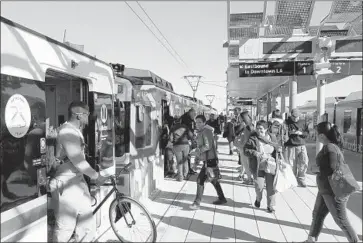  ?? Al Seib Los Angeles Times ?? PASSENGERS at the Expo Line’s Culver City Station. Metro will take a financial hit with its no-fare offer.