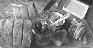  ?? BETH J. HARPAZ, THE ASSOCIATED PRESS ?? Bread, olives and other pre-dinner nibbles, served at Lost Kitchen meal last October.