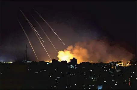  ?? ISRAEL Khalil Hamra Associated Press ?? has targeted buildings in Gaza City, above, and elsewhere in response to heavy rocket fire from Hamas militants since Monday.