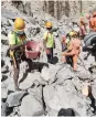  ?? ?? NDRF personnel clearing rocks to reach the body of last victim, on Sunday