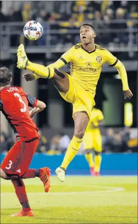  ?? Adam Cairns Columbus Dispatch ?? OLA KAMARA, shown leaping for the ball last season, has been one of the league’s deadliest strikers, scoring 16 goals in 2016 and 18 in 2017 for Columbus.