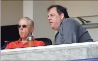  ?? Jeff Roberson / Associated Press ?? Mets owner Fred Wilpon, left, talks with New Jersey Gov. Chris Christie before an exhibition spring training game between the Mets and Yankees in 2016.