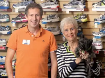  ?? FILE PHOTO ?? Don Starr and his mother, Linda Starr, seen here holding her Yorkiepoo, Sadie, not only work in fitness, but live it. Linda is active in the Women Can Run/Walk Clinics, while Don participat­es in several races and triathlons during the year.