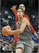  ?? JESSICA HILL — THE ASSOCIATED PRESS ?? Connecticu­t’s Kia Nurse, foreground, drives to the basket as Maryland’s Blair Watson, back, defends during the second half an Sunday in Hartford, Conn.