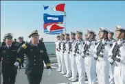  ?? WANG SONGQI / FOR CHINA DAILY ?? Rear Admiral Zhang Wendan, commander of the North Sea Fleet, views the guard of honor on the CNS Xining in Qingdao, Shandong province, on Sunday.