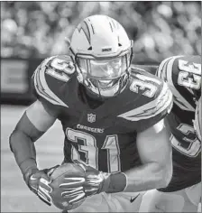  ?? Robert Gauthier Los Angeles Times ?? CHARGERS SAFETY Adrian Phillips, left, was a senior at Texas when his Longhorns routed Baker Mayfield’s Texas Tech team in 2013.