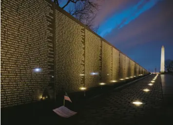  ?? MARK TENALLY/AP ?? The Vietnam Veterans Memorial and Washington Monument are illuminate­d at dawn on March 11, 2019, in Washington, D.C.