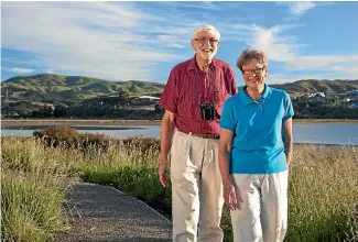  ??  ?? Marine biologist John Wells with wife Margery beside the Pauatahanu­i Inlet and, left, counting cockles in the inlet in 2010.